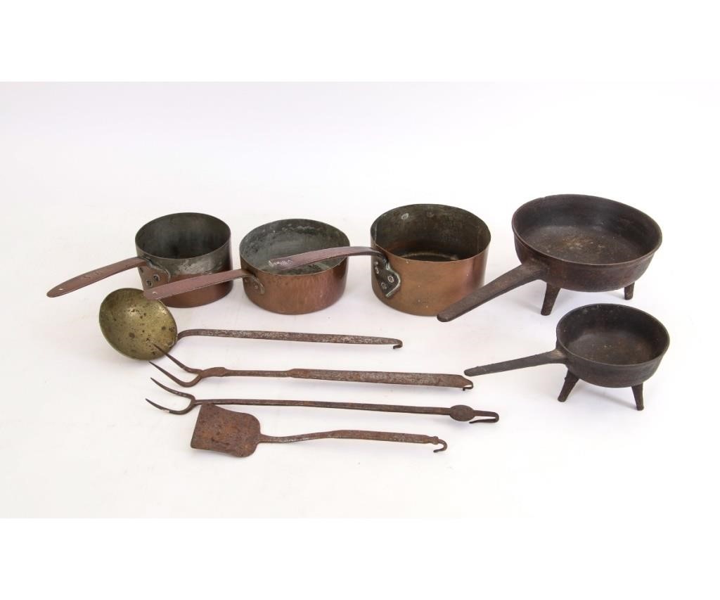 Two cast iron posnet pots,