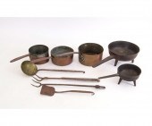 Two cast iron posnet pots, lar