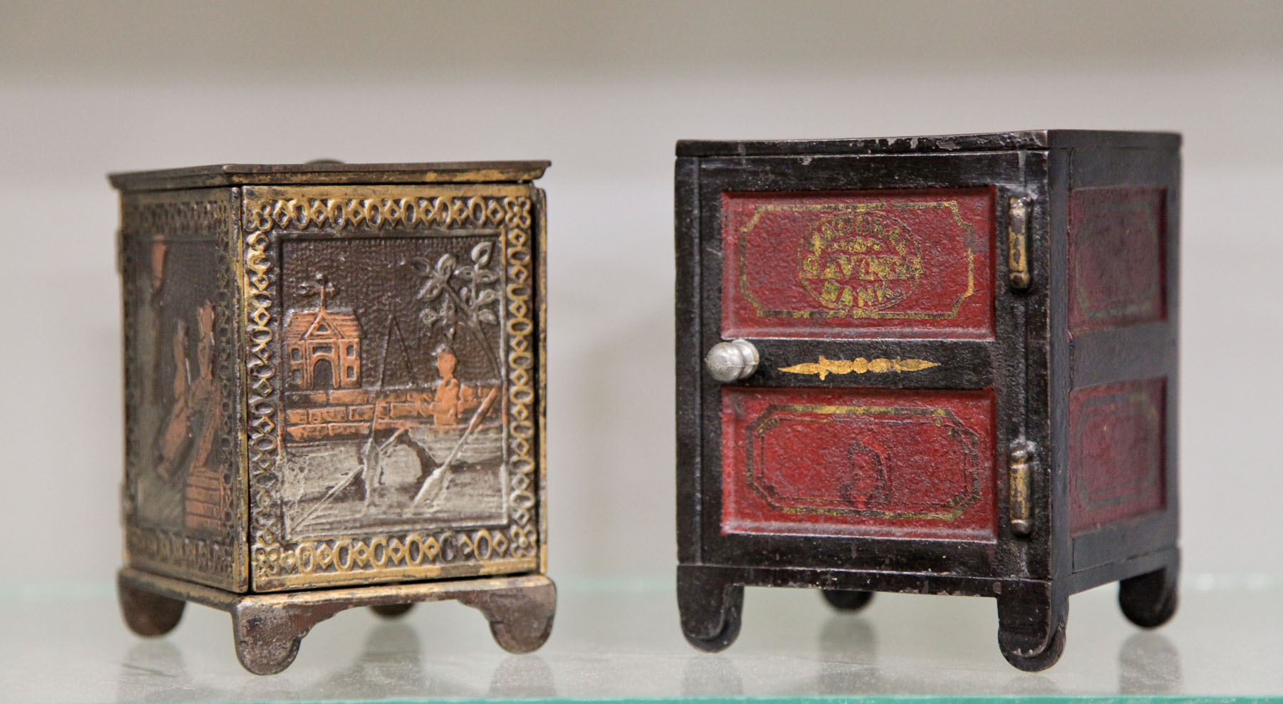 TWO CAST IRON STILL BANKS. 