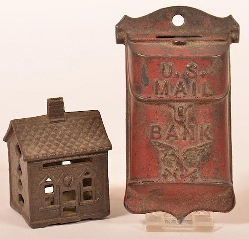 TWO CAST IRON STILL BANKS.Two