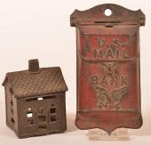 TWO CAST IRON STILL BANKS.Two
