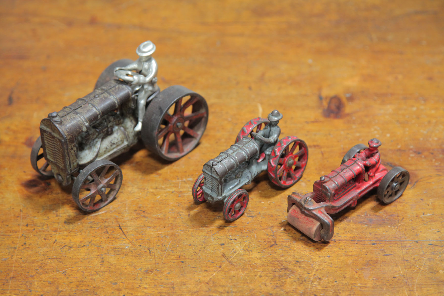 TWO CAST IRON TRACTORS AND A ROAD