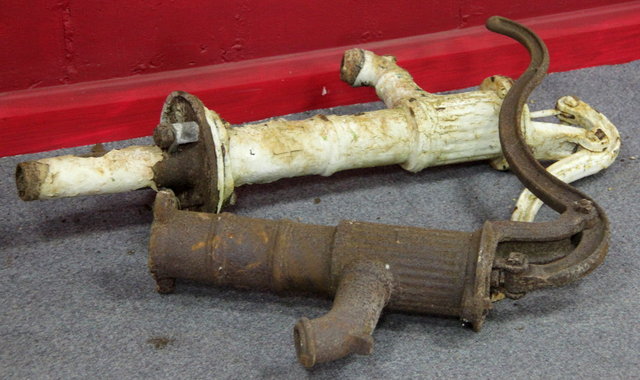 Two cast iron water pumps with