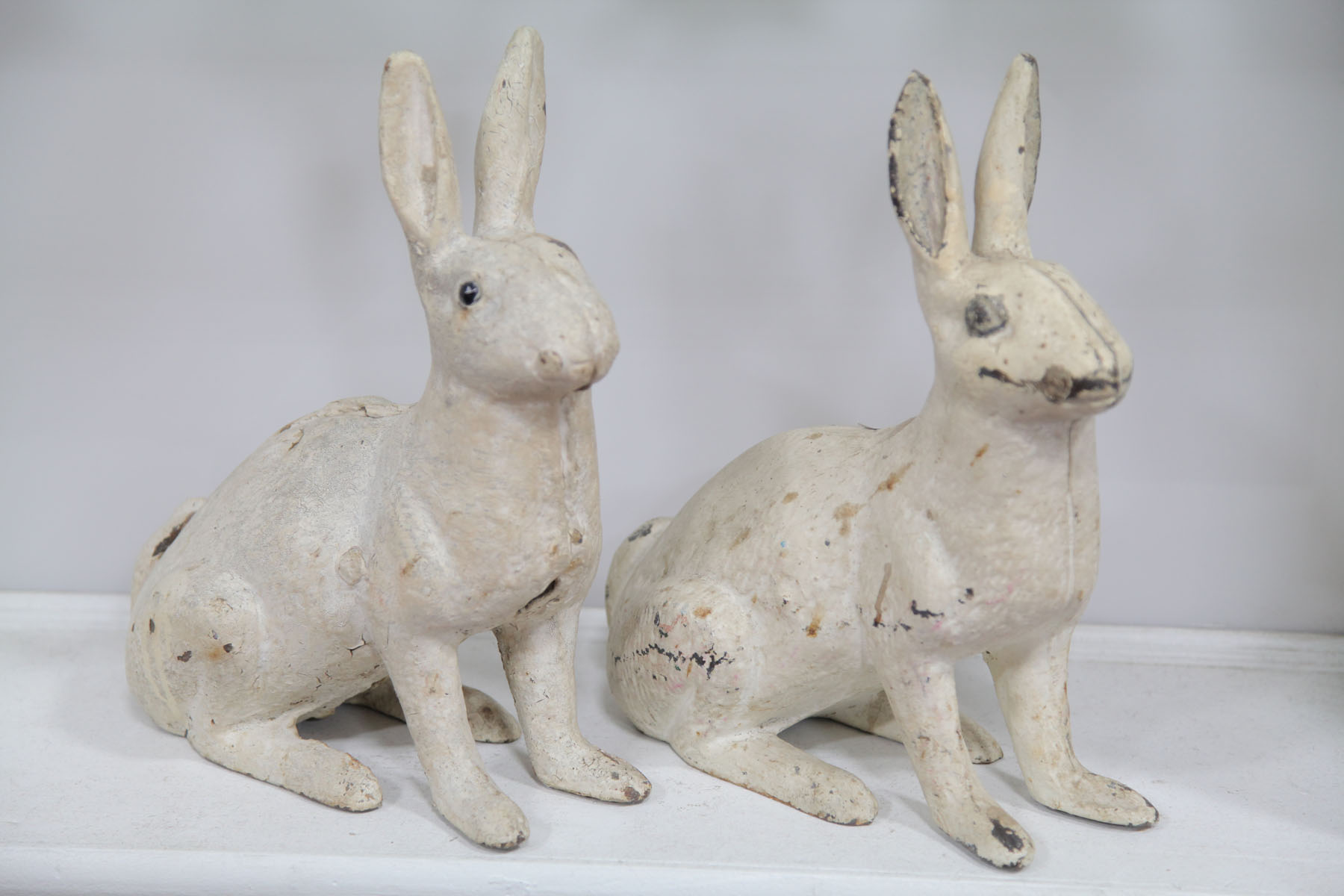 TWO CAST IRON YARD RABBITS. 