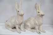 TWO CAST IRON YARD RABBITS.  A