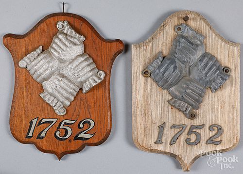 TWO CAST METAL FIREMARKSTwo cast