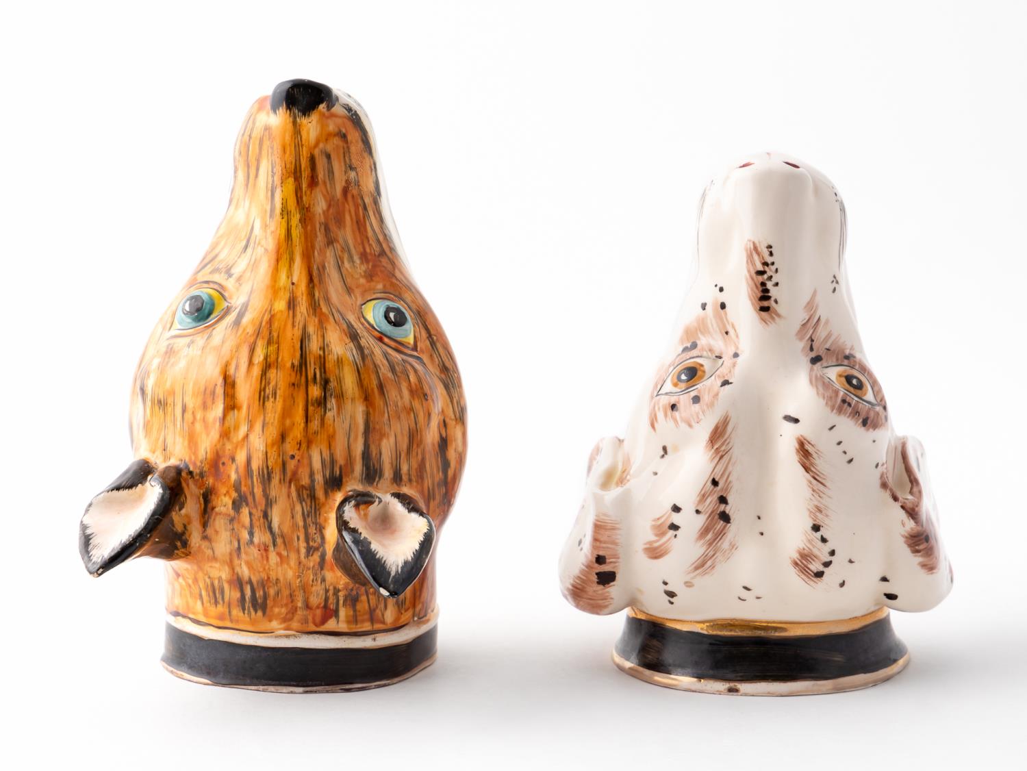 TWO CERAMIC STIRRUP CUPS, FOX AND
