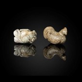 TWO 'CHICKEN-BONE' JADE CARVIN