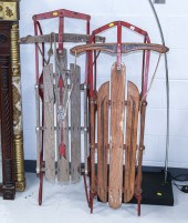TWO CHILDREN'S SLEDS One is an