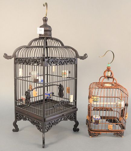 TWO CHINESE BIRD CAGES HAVING