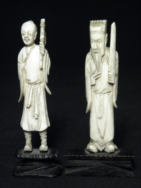 Two Chinese carved ivory figures.