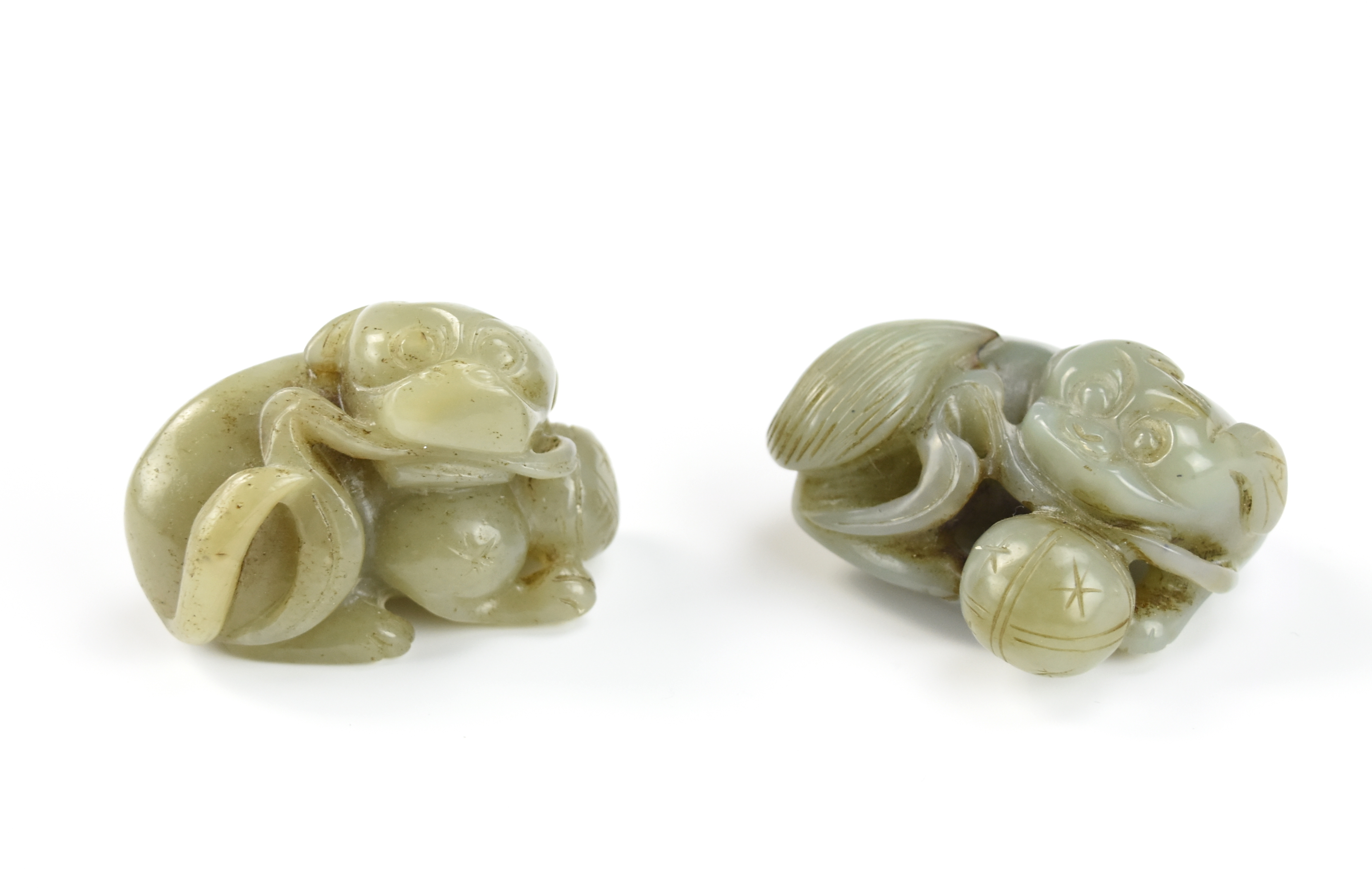 TWO CHINESE CARVED JADE FOO-DOG