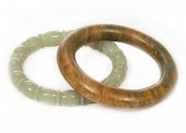 TWO CHINESE GREEN JADE BANGLES