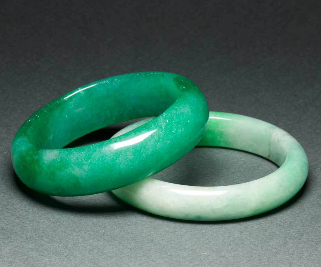 TWO CHINESE GREEN JADEITE BANGLES