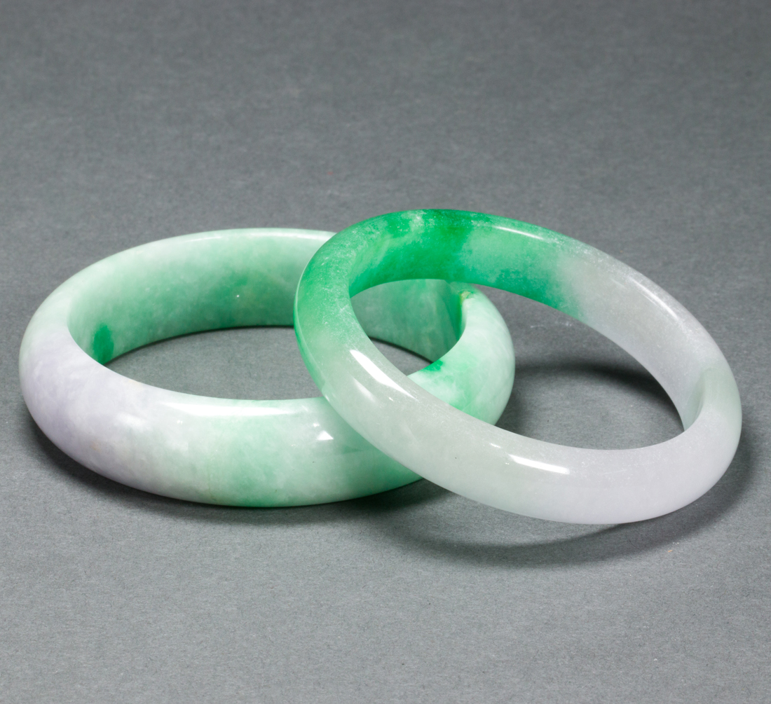 TWO CHINESE GREEN JADEITE BANGLES
