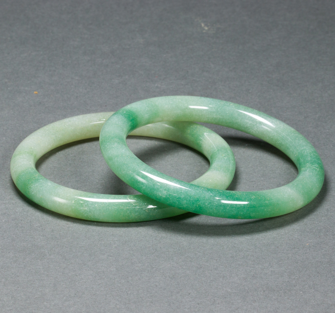 TWO CHINESE GREEN JADEITE BANGLES