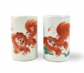 TWO CHINESE IRON RED FOO LION