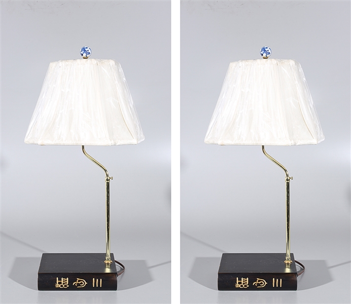 Two Chinese lamps mounted on carved