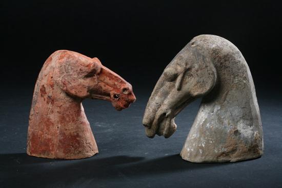 TWO CHINESE POTTERY HEAD OF