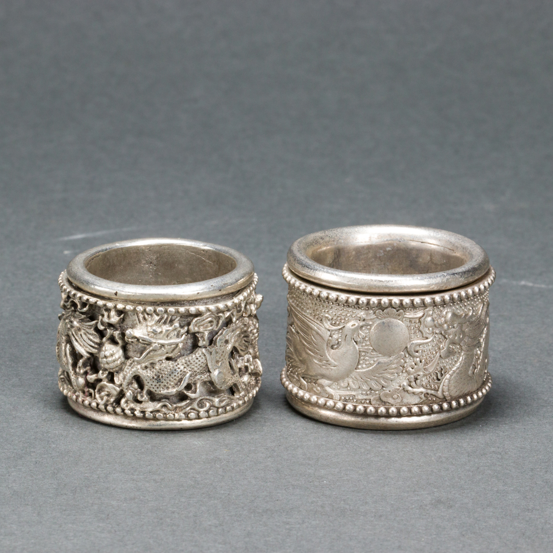 TWO CHINESE SILVER ARCHER'S RINGS