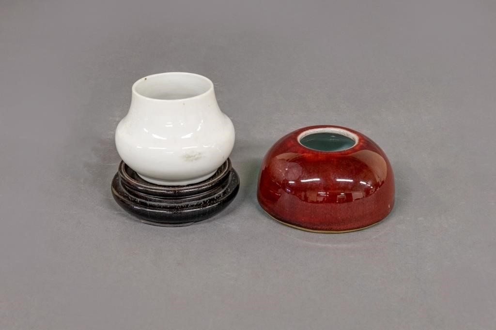 Two Chinese water cups, one on