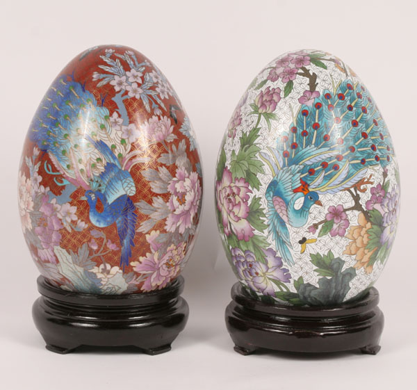 Two cloisonne eggs on stands,