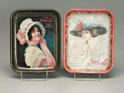 Two Coca-Cola trays: one