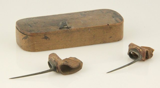 Two cockfighting spurs each with