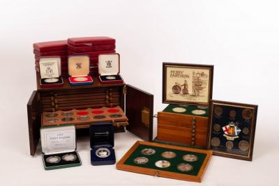 Two coin collector's cabinets and a