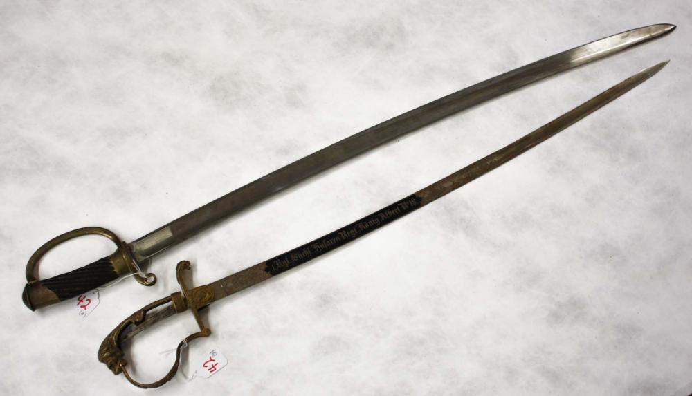 TWO COLLECTABLE SWORDS, THE FIRST A