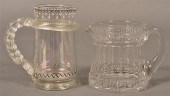 TWO COLORLESS GLASS PITCHERS.T