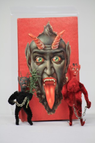 TWO COMPOSITION HEAD KRAMPUS IN BOX