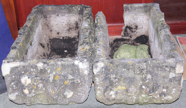 Two composition stone troughs
