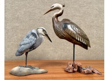 Two contemporary artisan carved and