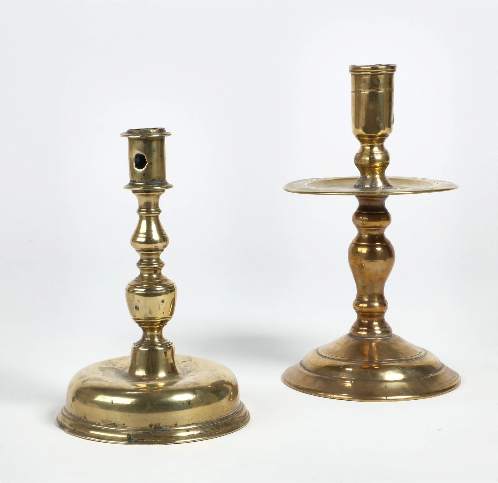 TWO CONTINENTAL BRASS CANDLESTICKS,