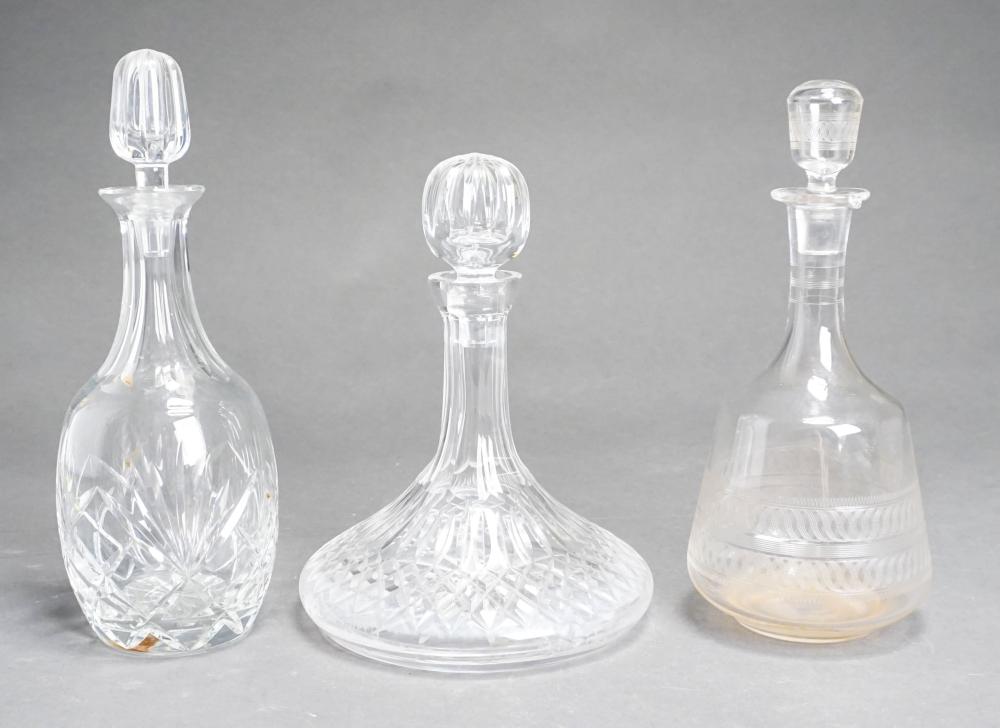 TWO CRYSTAL DECANTERS AND A GLASS