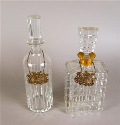 Two cut glass decanters    One