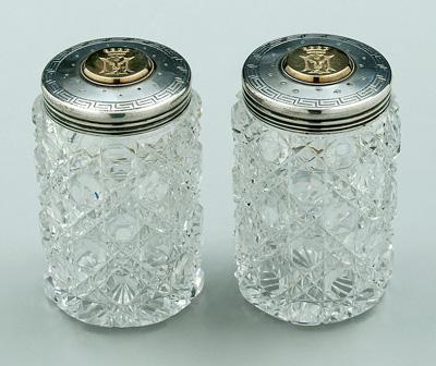 Two cut glass jars, silver lids: