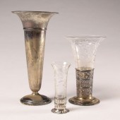 Two cut glass vases with flora