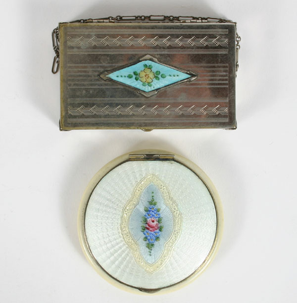 Two decorated compacts; one with