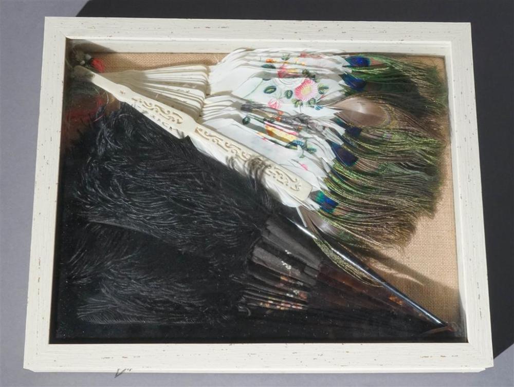 TWO DECORATED HAND FANS IN A SHADOW