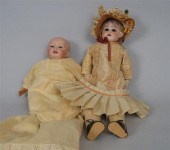 Two dolls    The first with bi