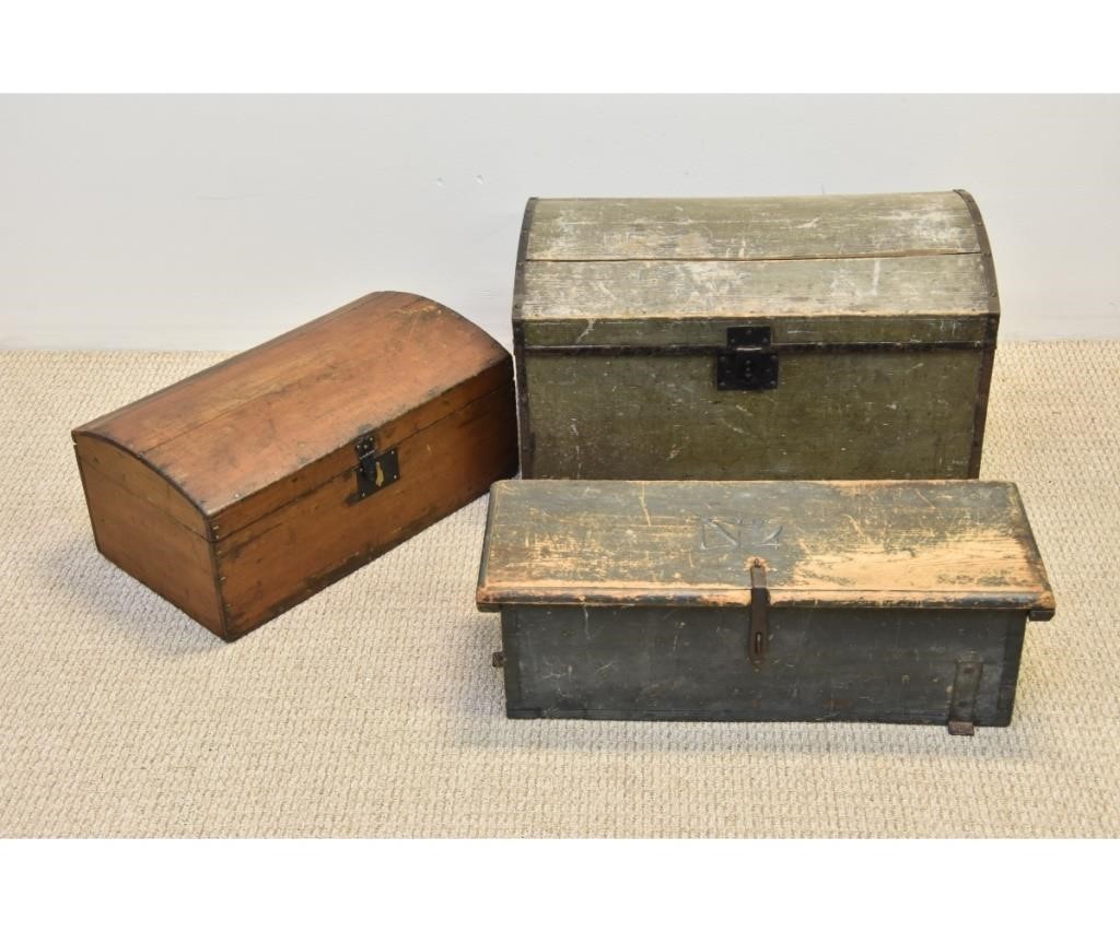 Two dome lid wood trunks, largest