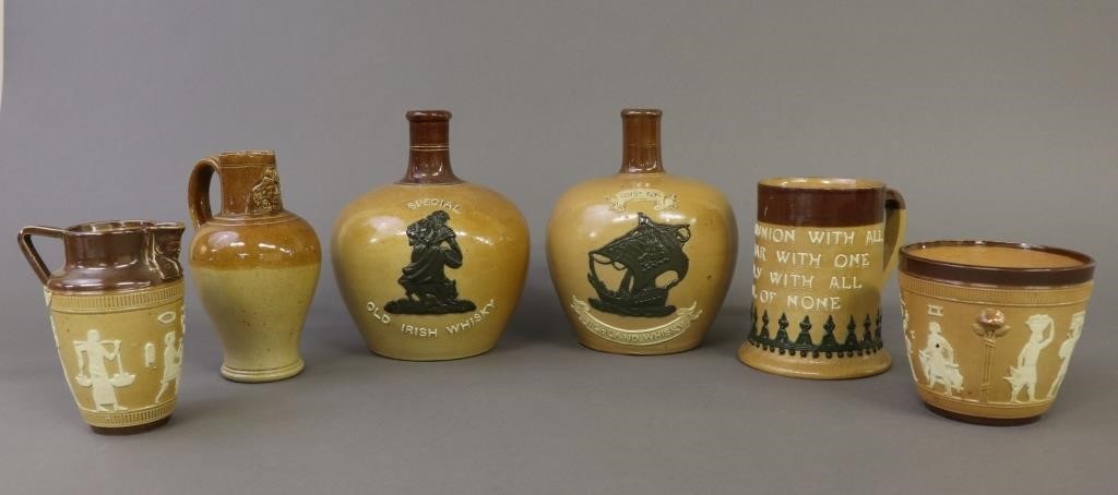 Two Doulton Lambeth whiskey jugs, 7