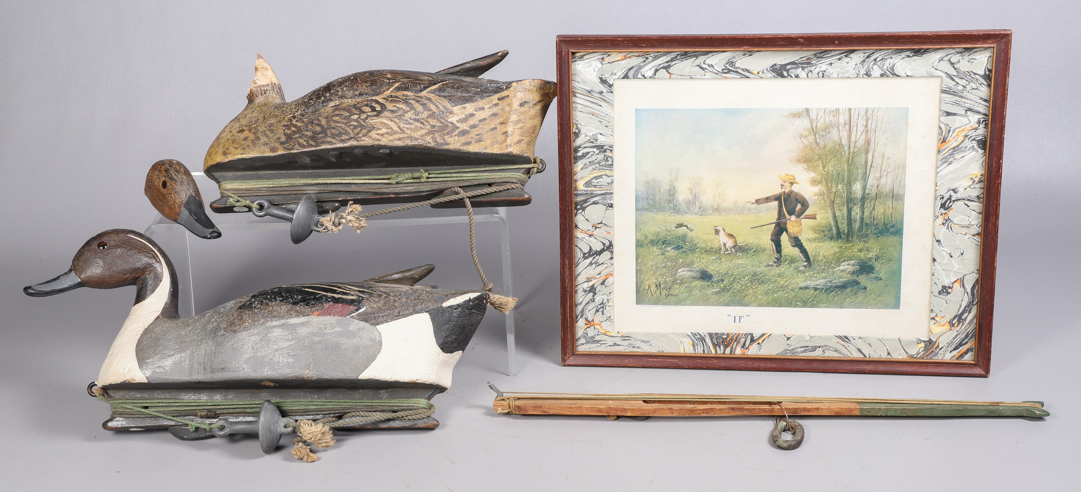Two duck decoys each signed "Made