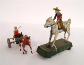 Two early 1900s tin toys: a li