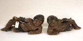 TWO EARLY CARVED WOOD RECLININ