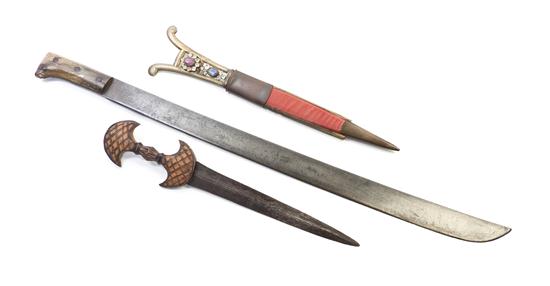 * Two Eastern Daggers each having a