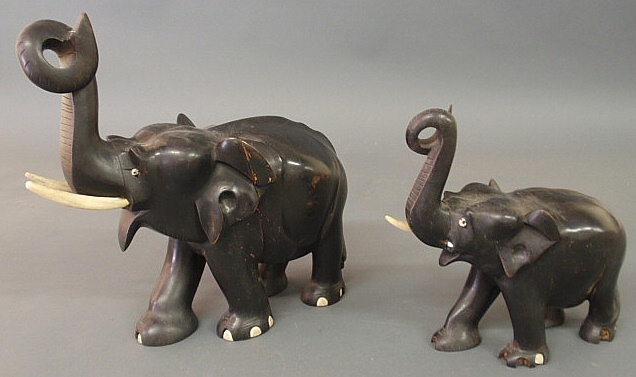 Two ebonized carved elephants