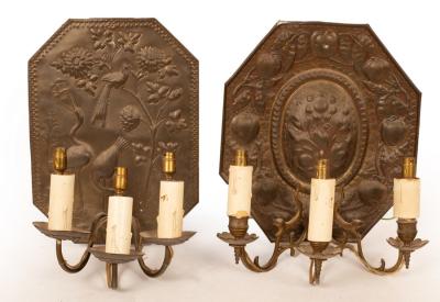 Two embossed brass wall sconces,